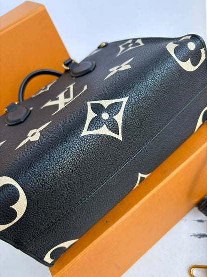 Louis Vuitton On the Go impriente pm Excellent Condition
